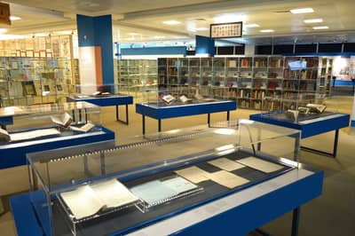 A photo of the National Library Donors' Gallery, with showcases in the foreground.