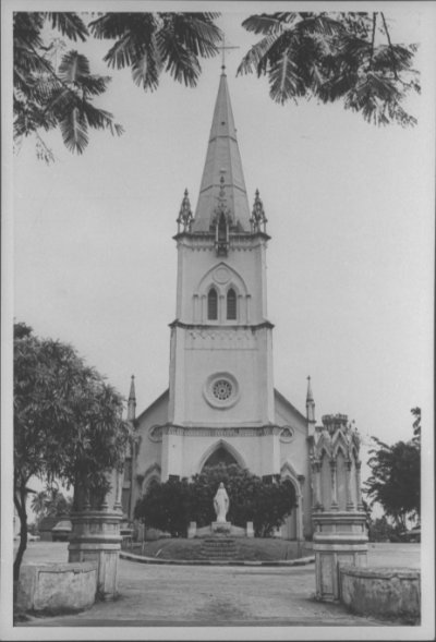 A black and white photo of 152 feet-tall spire-topped tower of the Church of The Nativity of the Blessed Virgin Mary, located at Upper Serangoon Road.
