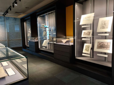 A photo showing an overview of the Rare Collection Gallery, with various showcases with pictures and books in them.